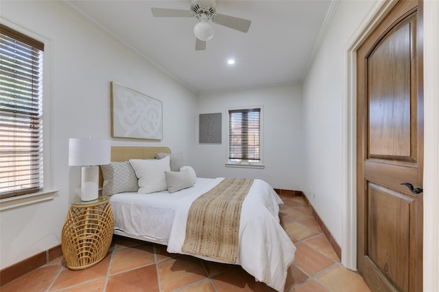 bedroom with light tile patterned floors, baseboards, ornamental molding, and ceiling fan