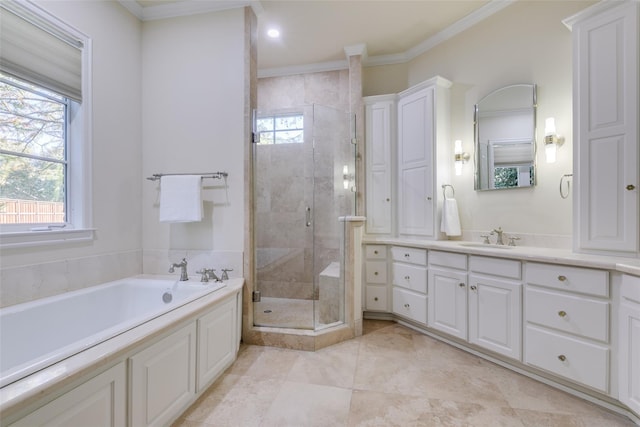 bathroom with a garden tub, ornamental molding, a stall shower, and vanity