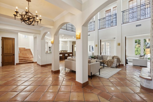 building lobby featuring stairway and visible vents