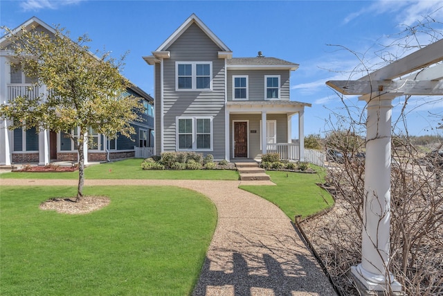 view of front of house with a porch and a front lawn