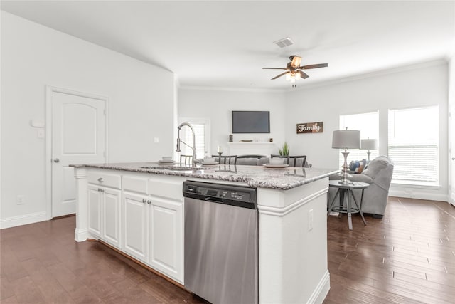 kitchen with open floor plan, visible vents, dishwasher, and a sink