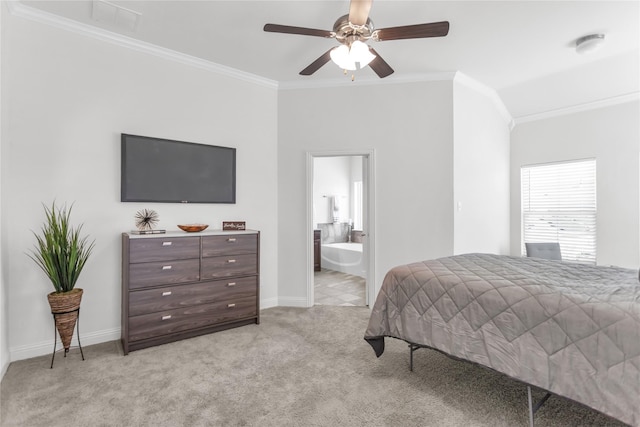 bedroom featuring ornamental molding, light colored carpet, baseboards, and ensuite bathroom