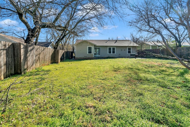 view of yard with a fenced backyard