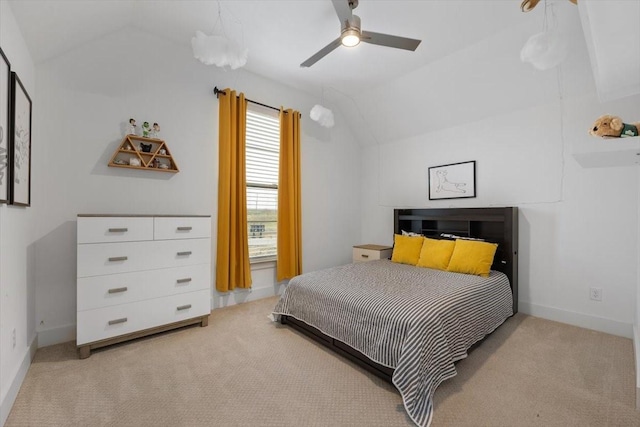 bedroom with carpet flooring, vaulted ceiling, baseboards, and ceiling fan