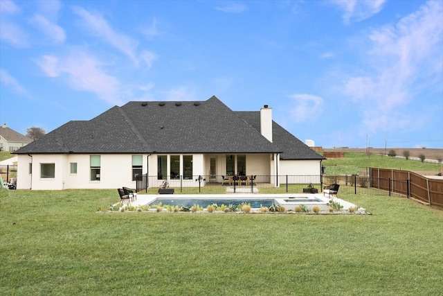 back of house featuring a fenced backyard, a shingled roof, a lawn, a fenced in pool, and a patio area