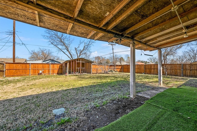 view of yard featuring an outdoor structure and a fenced backyard