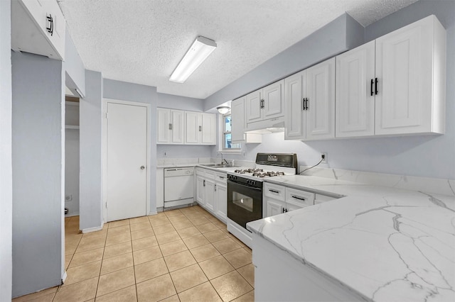 kitchen featuring under cabinet range hood, white cabinetry, range with gas cooktop, light stone countertops, and dishwasher