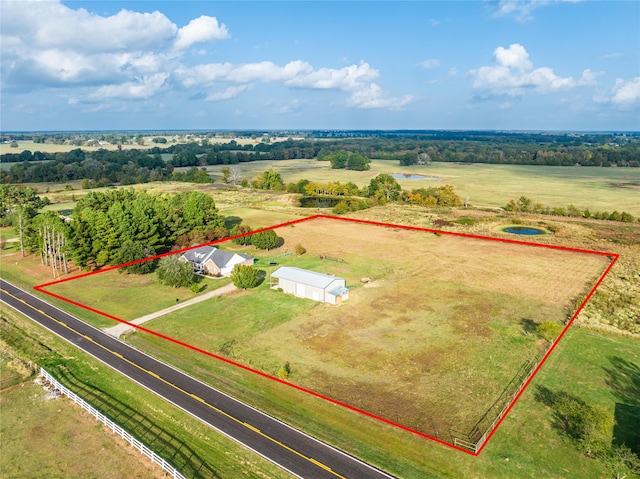 birds eye view of property featuring a rural view