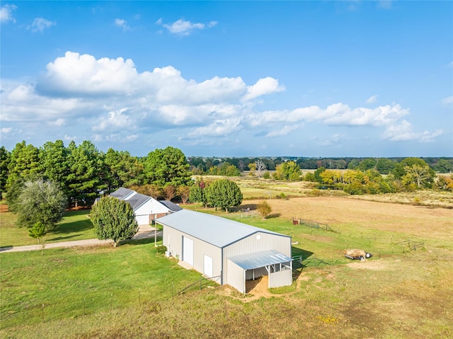 birds eye view of property with a rural view