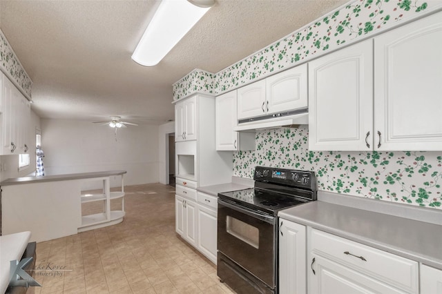 kitchen with white cabinetry, black range with electric cooktop, a ceiling fan, and under cabinet range hood