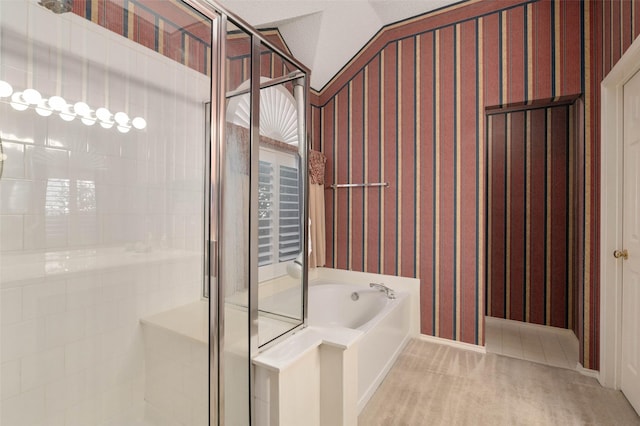 full bathroom featuring a bath, tile patterned flooring, and a stall shower