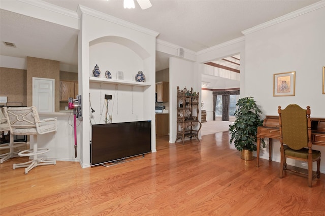 entrance foyer with visible vents, crown molding, and light wood finished floors