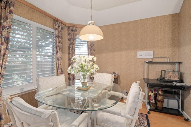 dining area with wallpapered walls