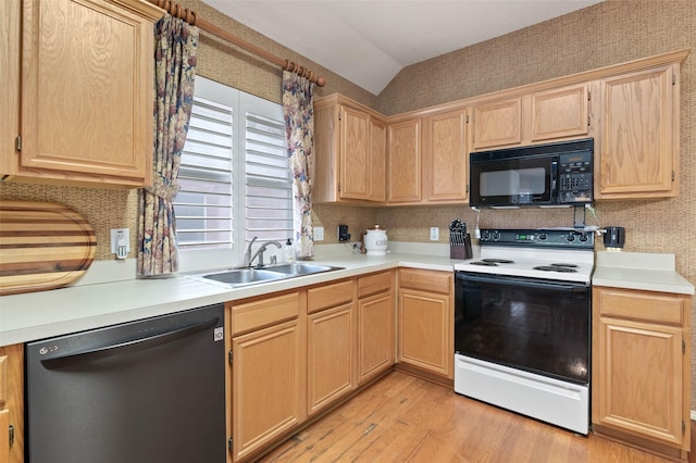 kitchen featuring light brown cabinets, electric range, a sink, black microwave, and dishwasher