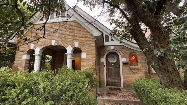 entrance to property with brick siding