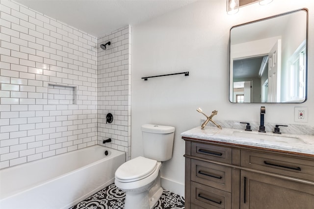 bathroom featuring bathing tub / shower combination, toilet, vanity, tile patterned flooring, and baseboards