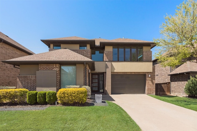 3743 Pistol Creek Dr, Frisco, TX 75034 - view of front of house featuring brick siding, stucco siding, driveway, a shingled roof, and a garage