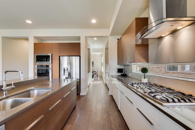 3743 Pistol Creek Dr, Frisco, TX 75034 - kitchen featuring stainless steel appliances, a sink, brown cabinets, modern cabinets, and recessed lighting