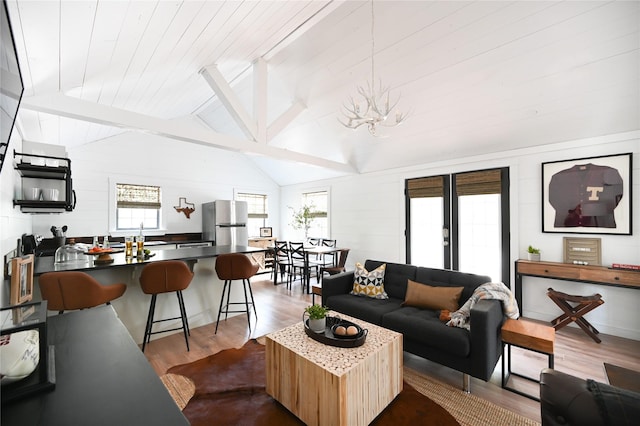 living area featuring dark wood-style flooring, wooden ceiling, vaulted ceiling, and an inviting chandelier
