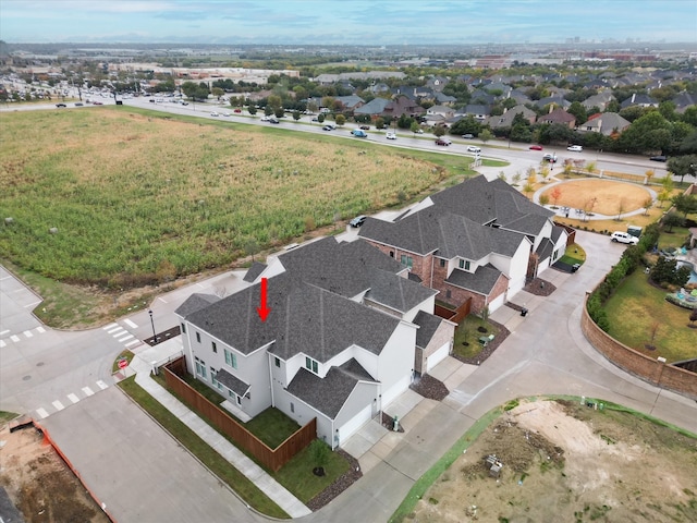 birds eye view of property with a residential view