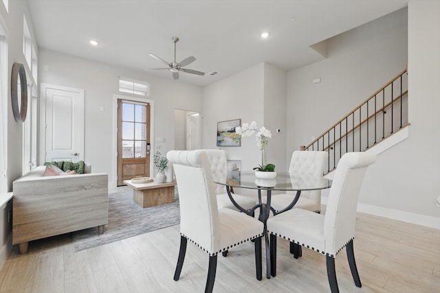 dining room featuring recessed lighting, stairway, a ceiling fan, light wood-type flooring, and baseboards