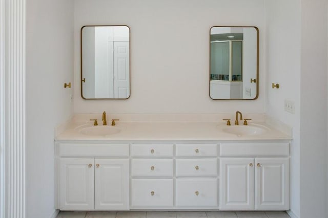 full bathroom featuring a sink and double vanity