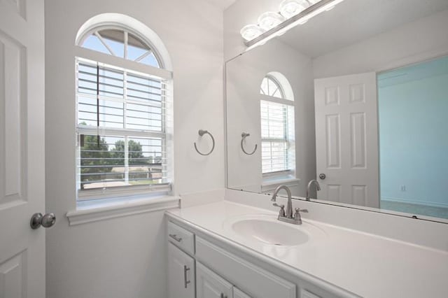 bathroom with a wealth of natural light and vanity