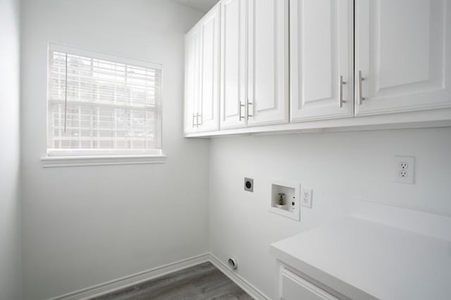 laundry room with hookup for a washing machine, cabinet space, plenty of natural light, and electric dryer hookup