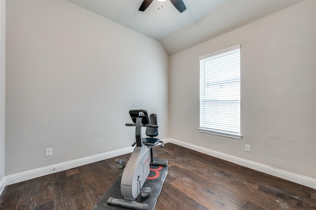 exercise room with vaulted ceiling, ceiling fan, hardwood / wood-style floors, and baseboards