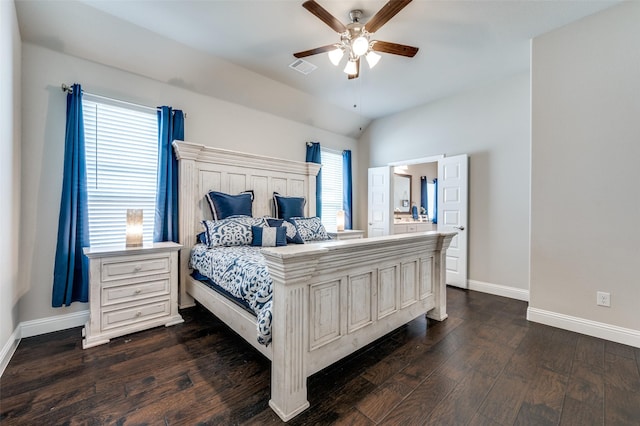 bedroom featuring dark wood-type flooring, lofted ceiling, multiple windows, and baseboards