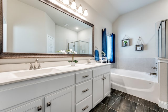 full bathroom featuring double vanity, a sink, a shower stall, and a bath