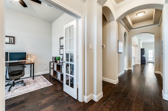 home office with baseboards, visible vents, arched walkways, ornamental molding, and wood finished floors