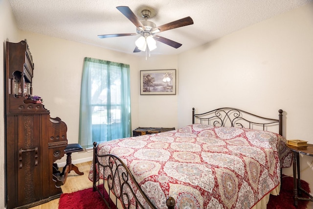 4017 Cherryhill Ct, Arlington, TX 76016 - bedroom with wood finished floors, a textured ceiling, and ceiling fan