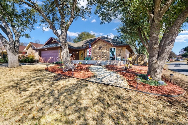 ranch-style house with an attached garage and brick siding