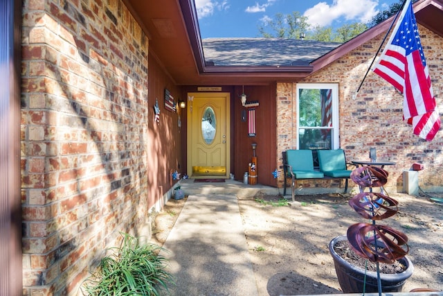 4017 Cherryhill Ct, Arlington, TX 76016 - view of exterior entry featuring roof with shingles and brick siding