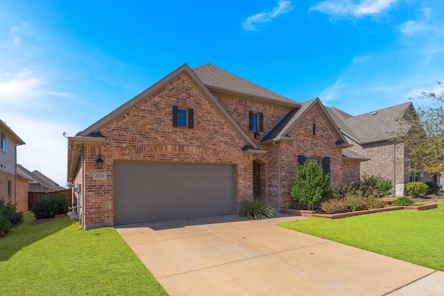 traditional home featuring brick siding, driveway, and a front yard