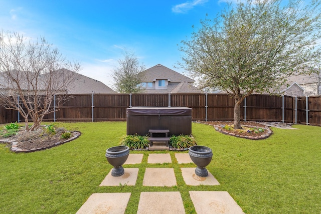 view of yard featuring a patio, a fenced backyard, and a hot tub