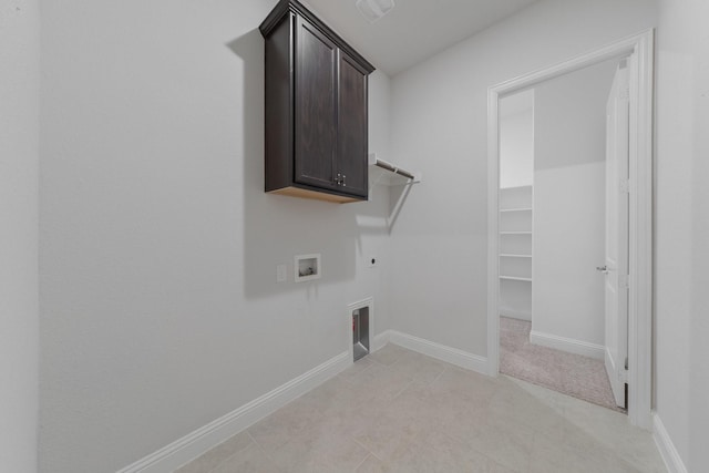 2121 Newton Ln, Mckinney, TX 75071 - laundry room featuring cabinet space, light tile patterned flooring, hookup for a washing machine, gas dryer hookup, and hookup for an electric dryer