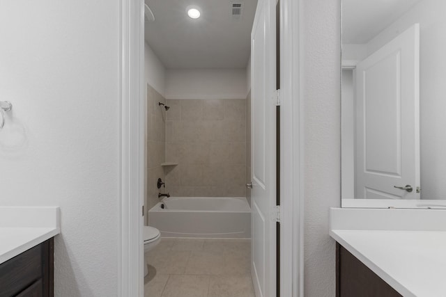 full bath with bathing tub / shower combination, visible vents, toilet, vanity, and tile patterned floors