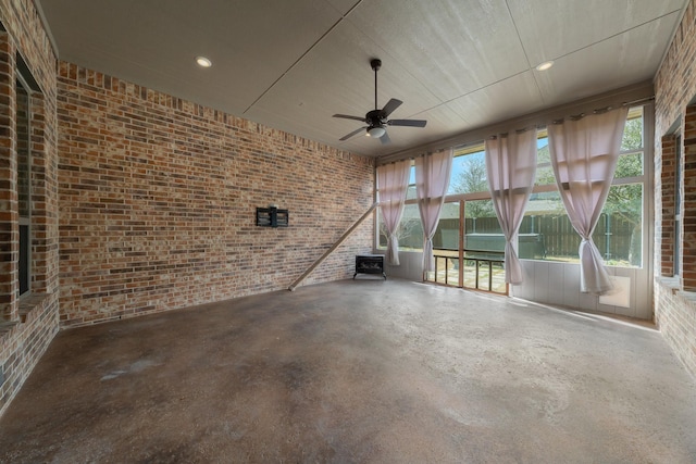 interior space with ceiling fan