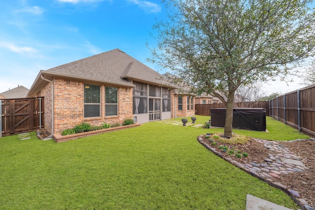 2121 Newton Ln, Mckinney, TX 75071 - rear view of house featuring a fenced backyard, brick siding, a shingled roof, a hot tub, and a yard