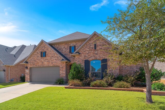 2121 Newton Ln, Mckinney, TX 75071 - traditional home featuring brick siding, a garage, a front lawn, and driveway