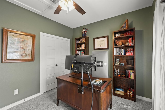 office with ceiling fan, baseboards, and light colored carpet