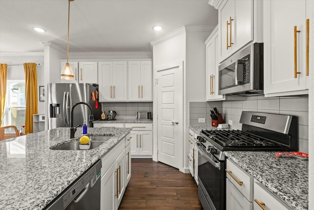 kitchen with stainless steel appliances, a sink, white cabinets, dark wood-style floors, and crown molding