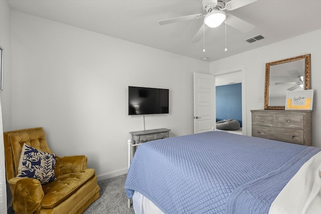 carpeted bedroom with visible vents, ceiling fan, and baseboards