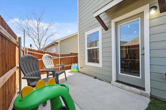 view of patio featuring fence