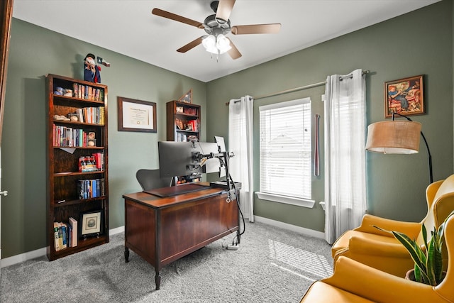 office space with carpet floors, ceiling fan, and baseboards