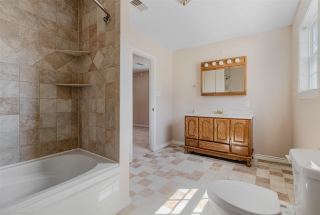 bathroom featuring toilet, baseboards, visible vents, and vanity