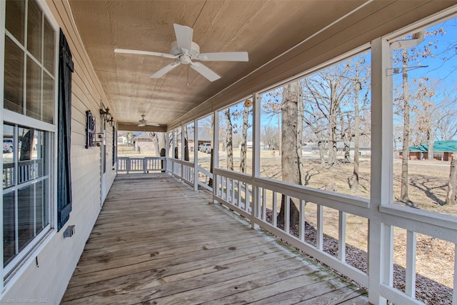 deck featuring a porch and a ceiling fan