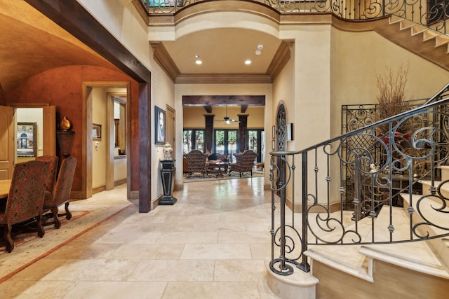 entrance foyer with stairs, baseboards, crown molding, and recessed lighting